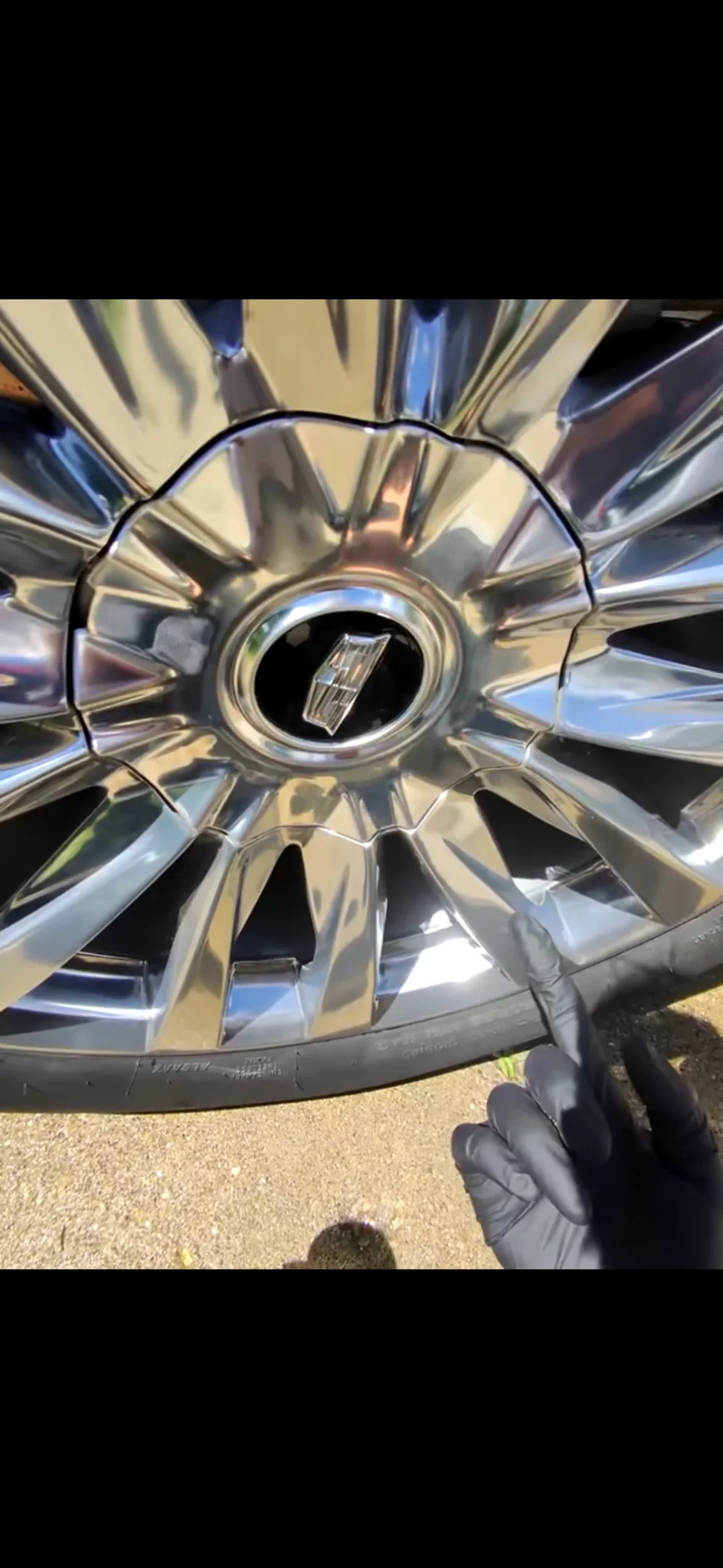 Same chrome wheel after detailing, polished to a mirror finish
